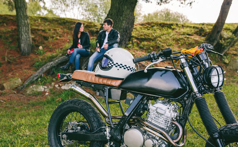 Custom motorbike with young couple