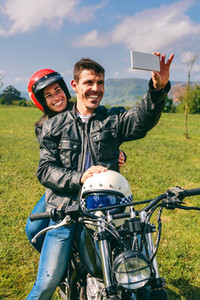 Couple taking a selfie on the motorcycle