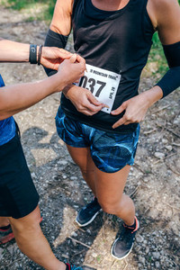 Girl placing the race number