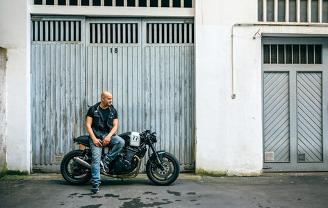 Biker posing with a motorcycle