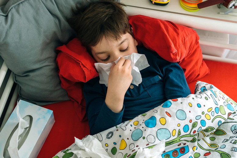 Cold child lying on the bed