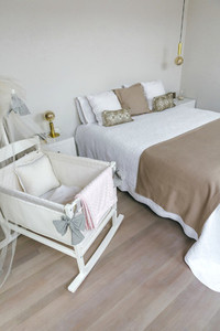 Bedroom with double bed and cot