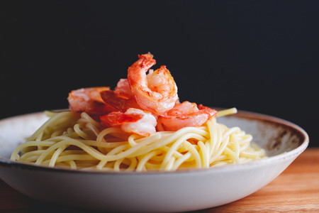 Fried shrimps on the pasta The concept of dinner or lunch with seafood