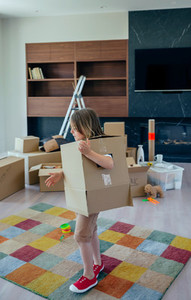 child playing with moving box