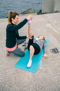 Female trainer with senior woman
