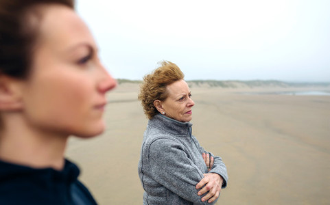 Two women looking at sea