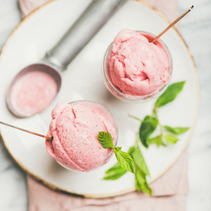 Homemade strawberry yogurt ice cream with mint  square crop