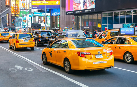 Yellow cabs on the busy traffic of Manhattan  in New York City  USA