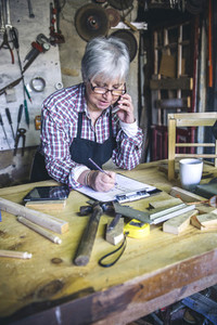 Female carpenter in his workshop