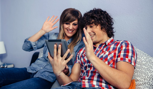 Couple making video call with the tablet