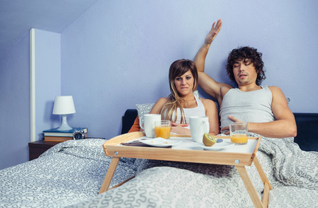 Young couple with stomach pain after eat breakfast