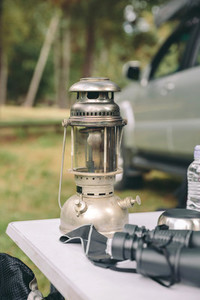 Close up of oil lamp over camping table