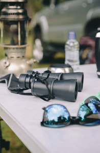 Close up of binoculars over camping table