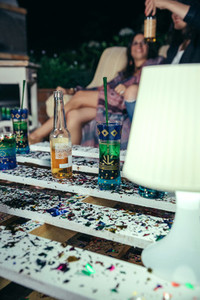 Beverages over pallets table with confetti in outdoors party