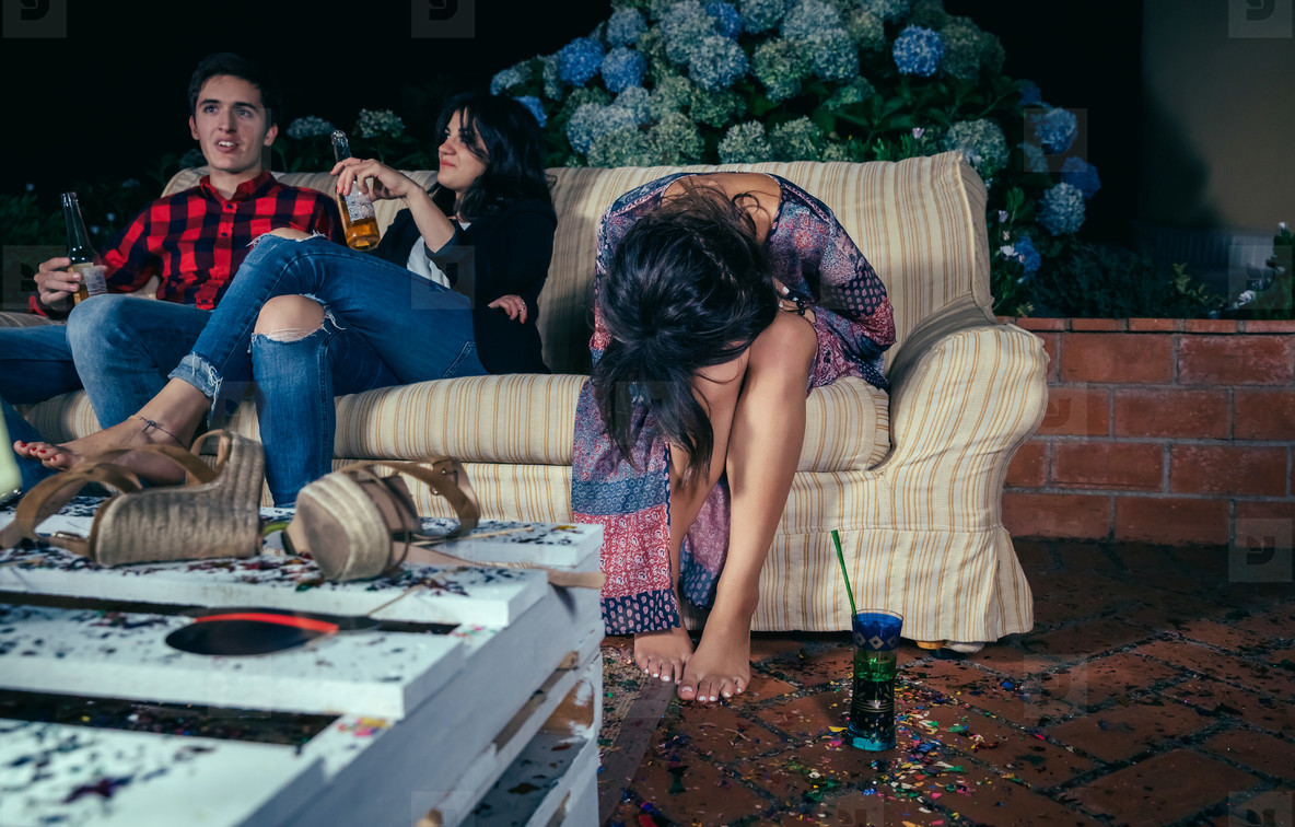 Young drunk woman sitting in the sofa on a party stock photo (196138) -  YouWorkForThem
