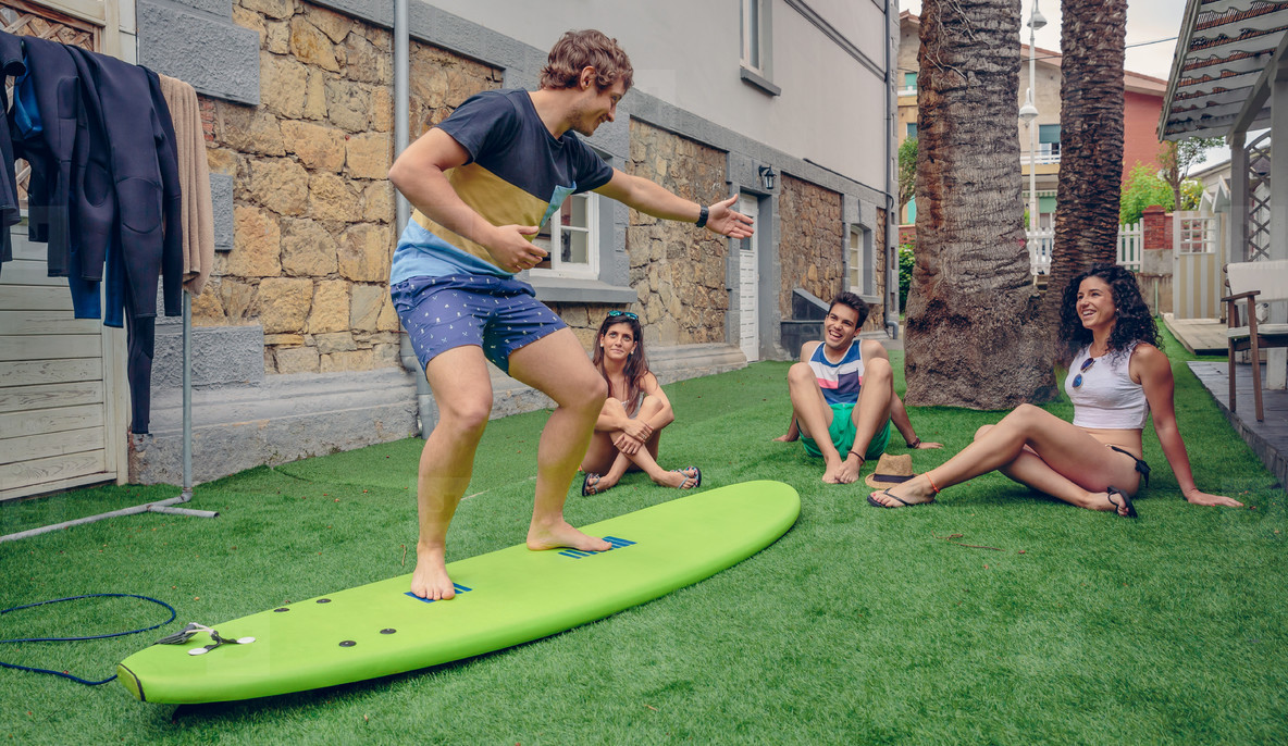 Group of people having fun in a surf class