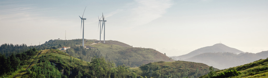 Mountain landscape with wind turbines in the background