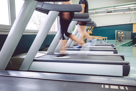 People legs in motion during a treadmill training