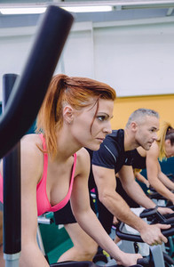 Woman concentrated in a hard bike training session