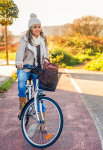 Young woman sit over bicycle in street bike lane