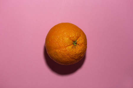 orange on a pink colored backgro