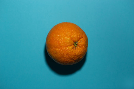 orange on a turquoise colored ba