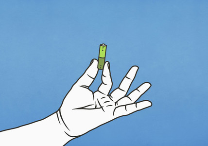 Hand holding green battery