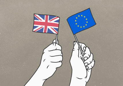 Hands waving small British and European Union flags