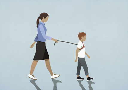 Mother walking son with harness