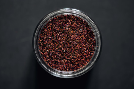 View from above Korean chili pepper flakes in spice jar