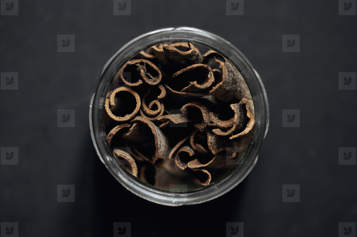 View from above cinnamon sticks in spice jar