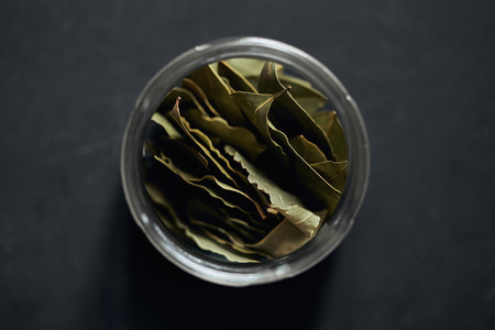 View from above bay leaves in spice jar