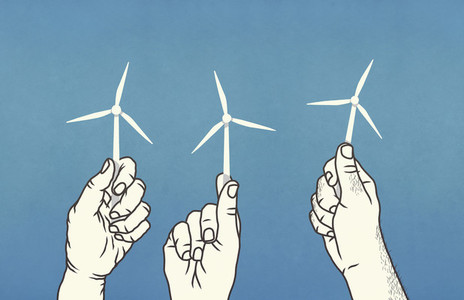 Hands holding tiny wind turbines