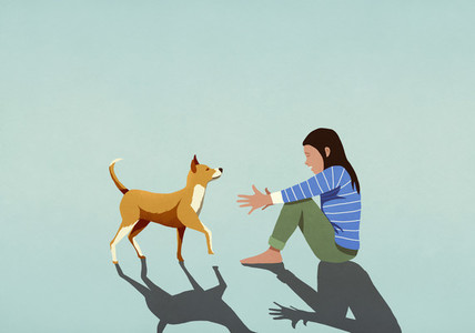 Dog walking toward woman with arms outstretched