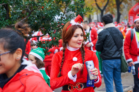 Madrid  Spain  December 8th 2019 Crowd of Santa Clauses running in street