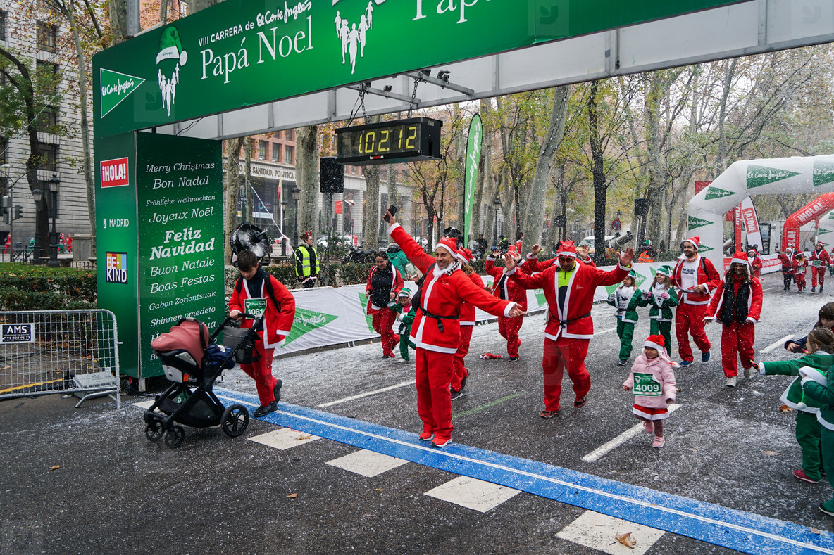 Madrid  Spain  December 8th 2019 Crowd of Santa Clauses running in street
