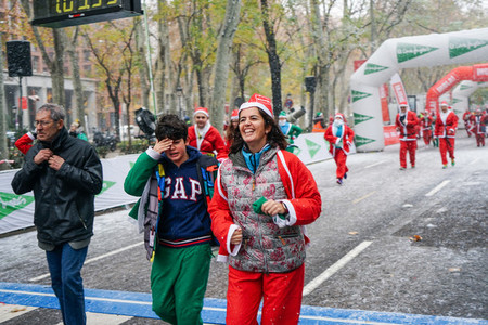 Madrid Spain December 8th 2019 Crowd of Santa Clauses running in street