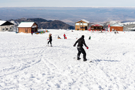 People having fun doing winter sports in Sierra Nevada