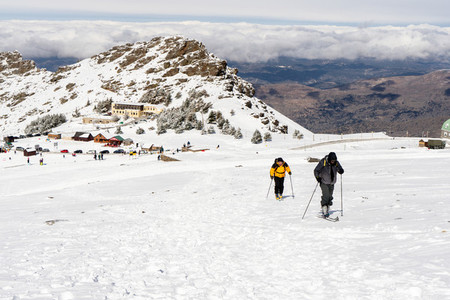 Two people cross country skiing in Sierra Nevada