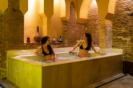 Two women enjoying Arabic baths Hammam in Granada