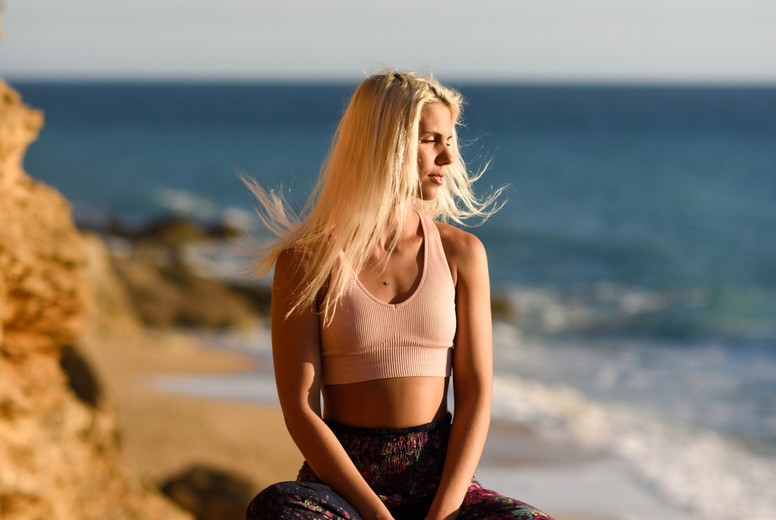Woman enjoying the sunset on a beautiful beach