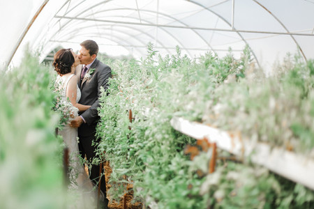 Bride and Groom in a greenhouse