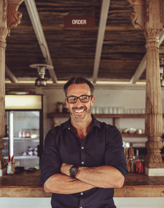 Portrait of a smiling cafe owner