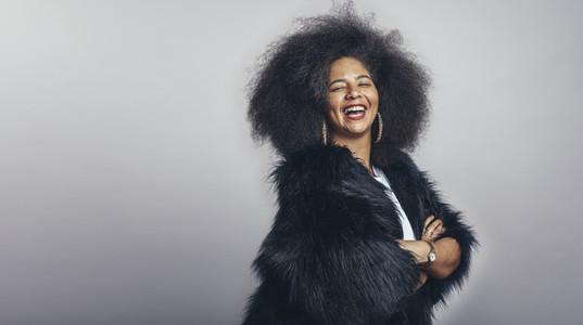 Smiling woman in afro hairstyle