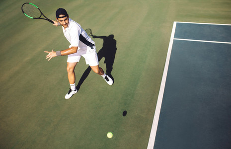 Tennis player hitting a forehand from baseline