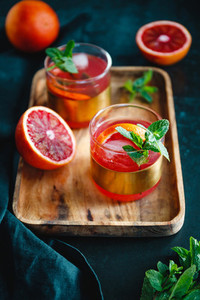 Refreshing cold summer cocktail with blood orange and mint