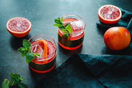 Refreshing cold summer cocktail with blood orange and mint