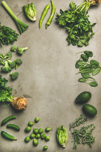 Healthy vegan ingredients layout over concrete table background  vertical composition