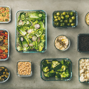 Healthy vegan or vegetarian dishes in containers  square crop