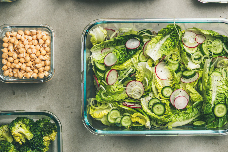 Healthy vegan or vegetarian dishes in glass containers, square crop